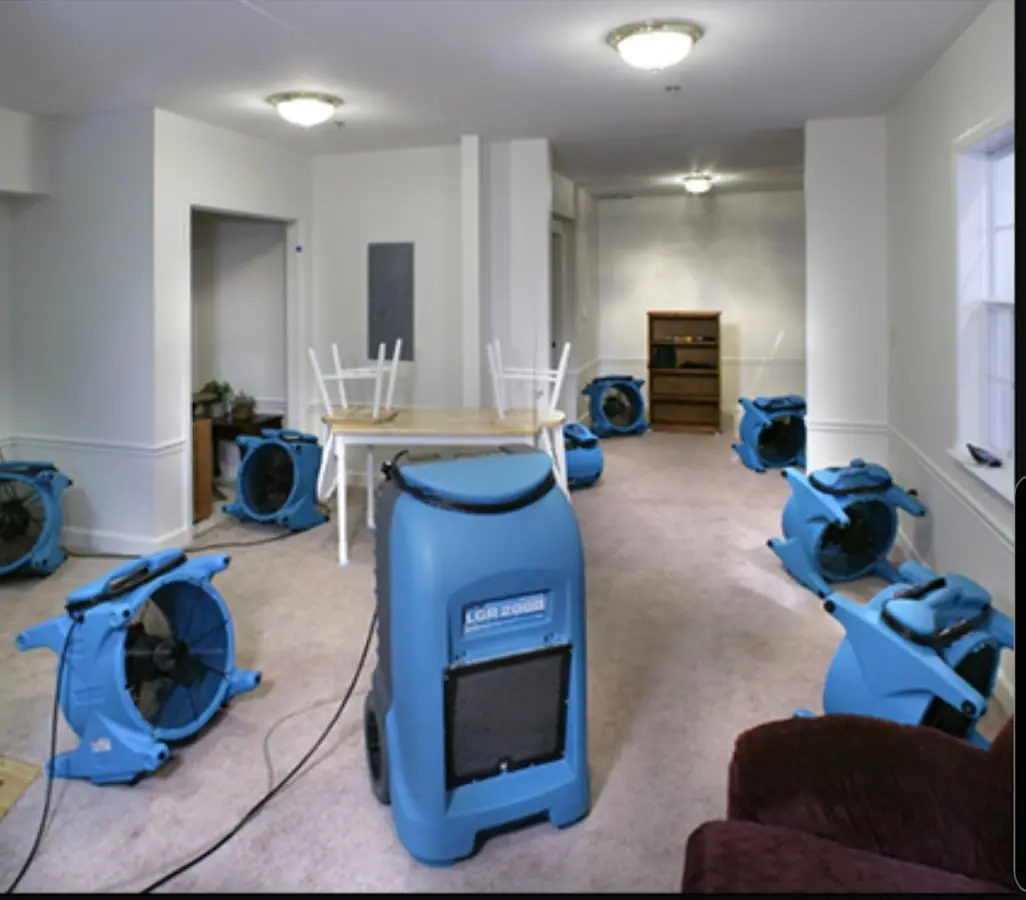 Air movers and dehumidifier setup for Water Damage Restoration in Page